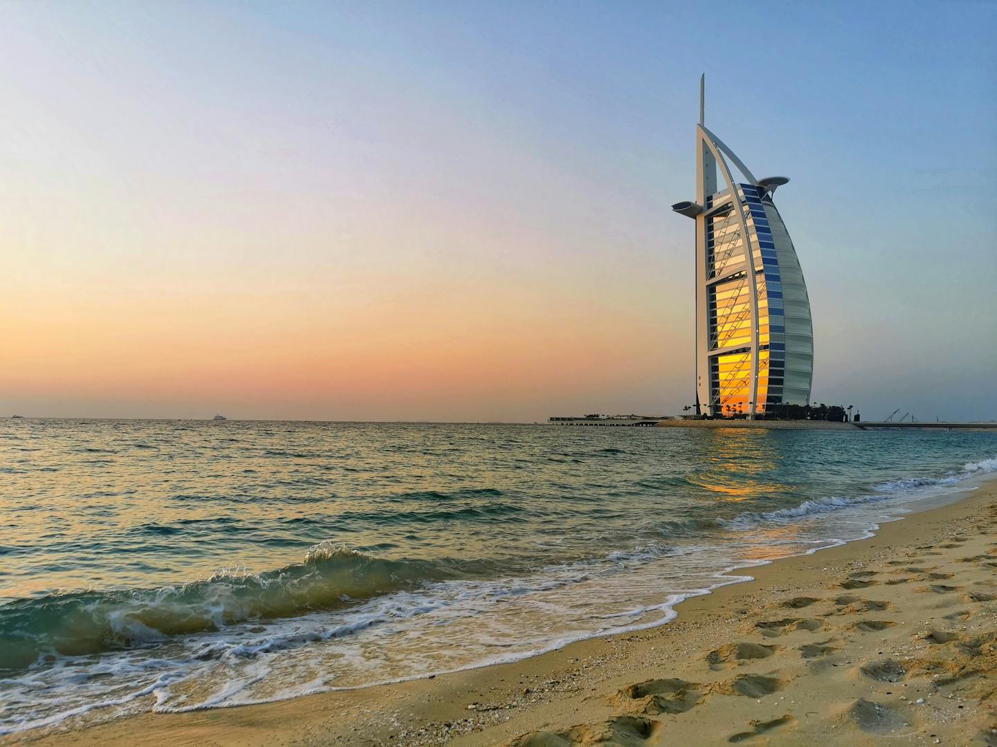 Palm tree on Jumeirah beach at sunset
